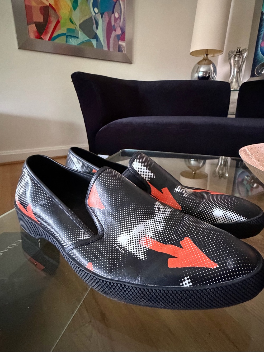 Prada Black Slip-On Sneakers with Orange Arrow Accents